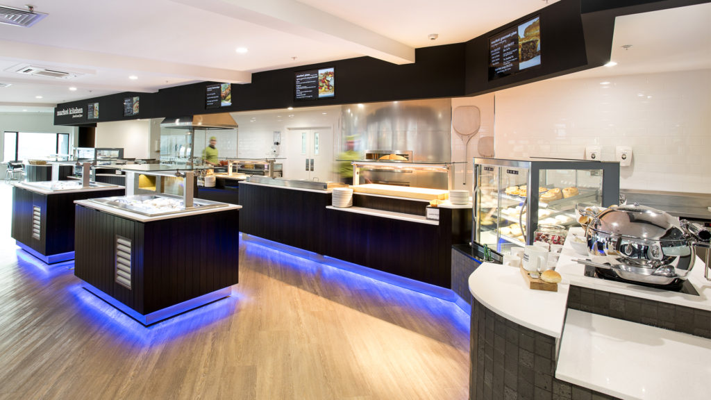 Image of the Skyline Market Kitchen in Queenstown, New Zealand. This photo demonstrates FPG's restaurant turnkey capabilities including design, build, and installation of custom joinery and integrated range of FPG food display cabinets.