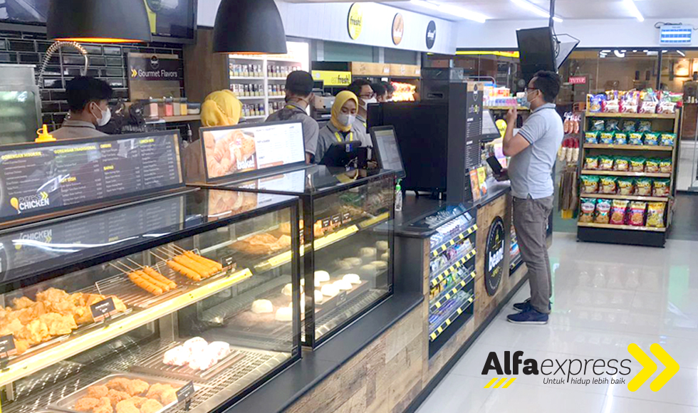 Image showing the FPG c-store fitout including POS counter with integrated confectionary display and food display cabinets at Alfaexpress Stasiun Bandung, Indonesia.