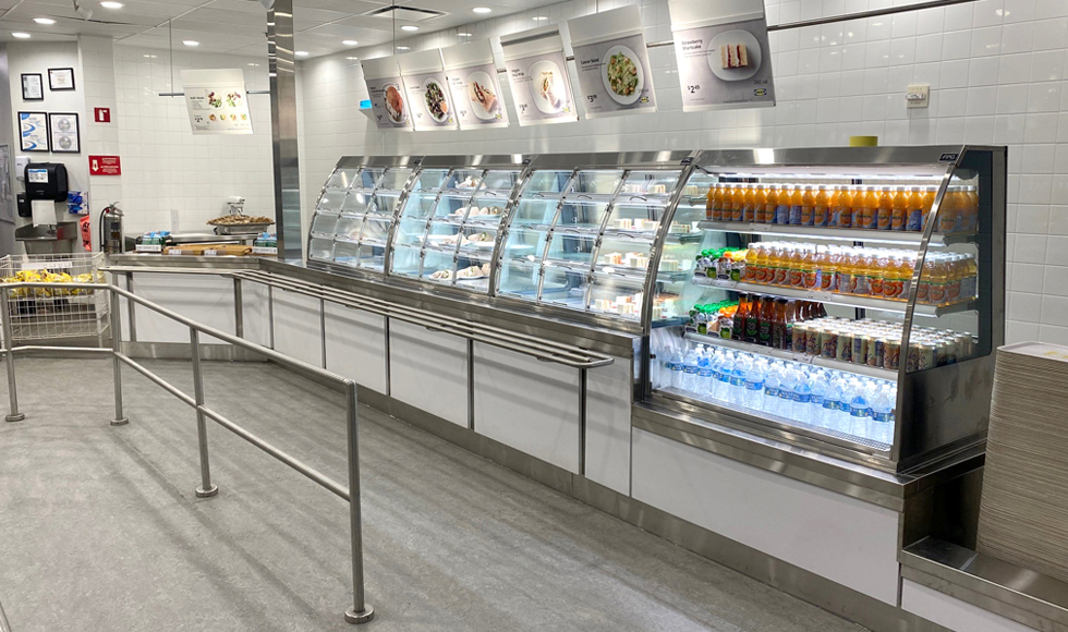 Image showing a lineup of FPG custom refrigerated food display cabinets including an open front cabinet stocked with drinks at IKEA, USA.