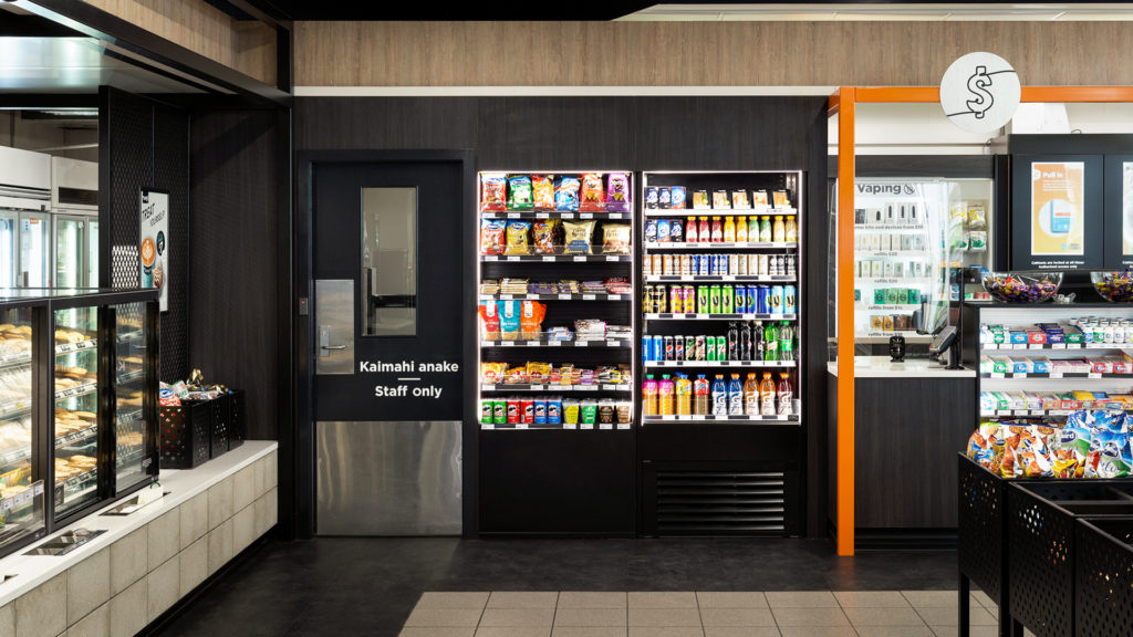 Image of FPG custom c-store fitout featuring the FPG Visair Slimline refrigerated drinks cabinet adjacent to custom ambient shelving inset into joinery at Z Energy, Waiuku, New Zealand.