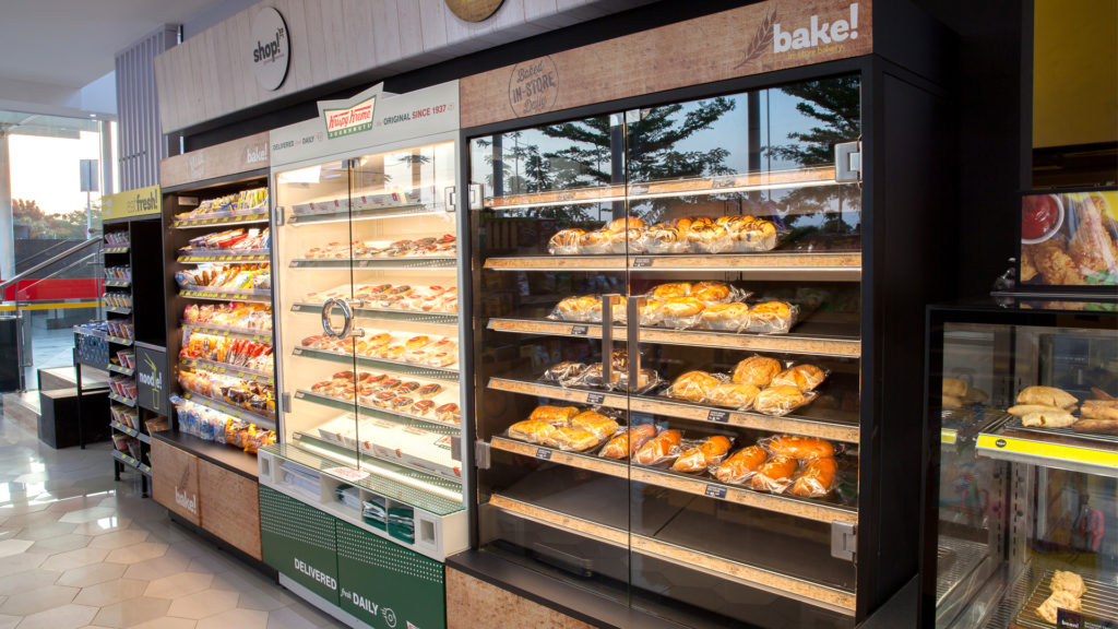 Image showing FPG custom c-store fitout featuring branded Krispy Kreme and adjacent ambient bakery cabinets at Alfamart, Alfa Tower, Jakarta, Indonesia.