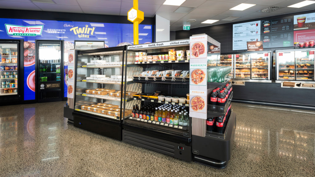 Image showing a custom island comprised of open front heated and refrigerated FPG Visair Upright cabinets and ambient gondola display ends at BP Tauranga, New Zealand.