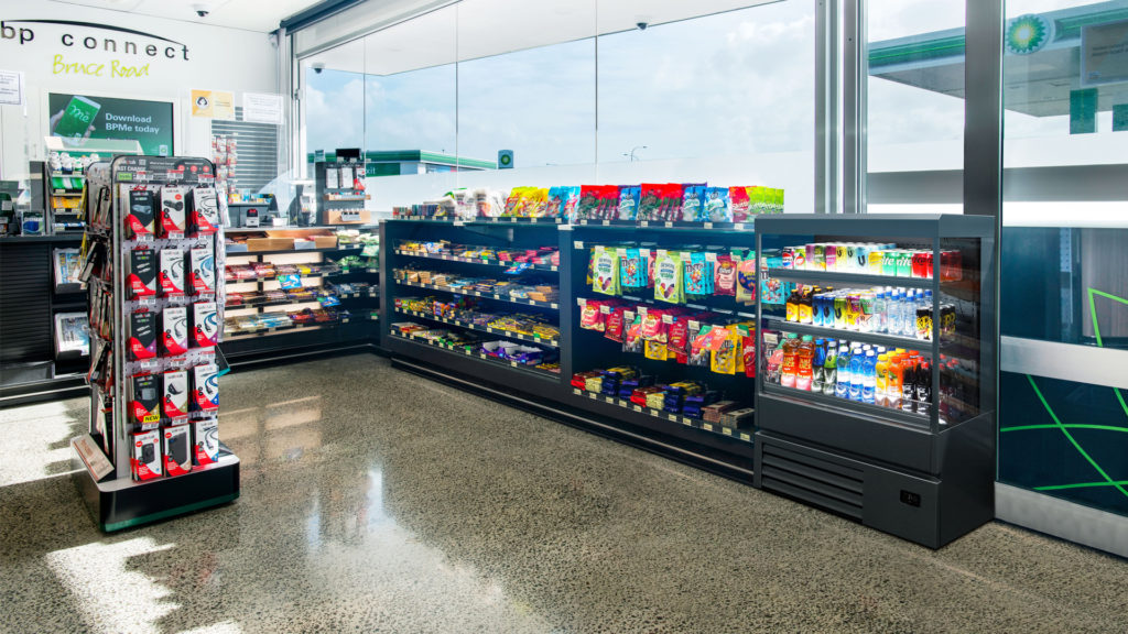 Concept showing a FPG Impulse Slim 12H 09W refrigerated R290 cabinet located with the confectionary run-up at a New Zealand fuel c-store.