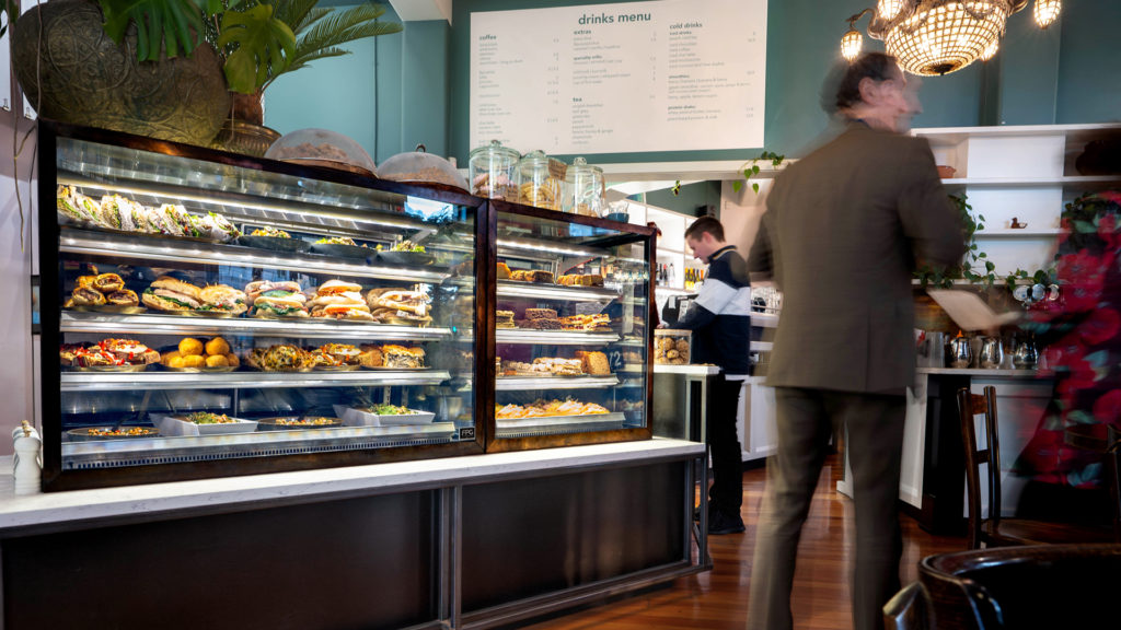Image showing FPG Inline Series food display cabinets with custom copper clad frames installed at Ajuna Eatery, Napier, New Zealand.