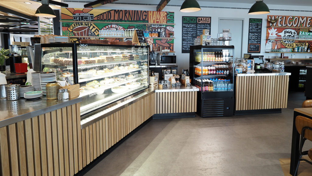 Image showing the FPG custom café fitout including counter joinery and temperature-controlled food and drink display cabinets at Bay Espresso Cafe, Napier Airport, New Zealand.
