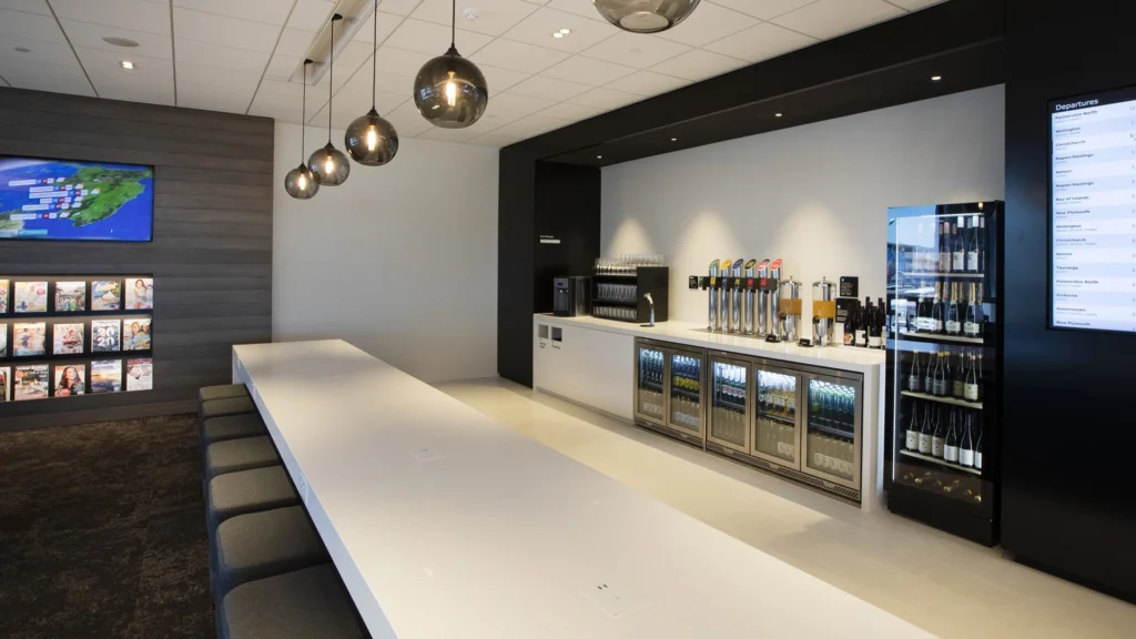Image showing Air New Zealand regional lounge at Auckland International Airport, New Zealand. FPG custom bar fitout, delivered in partnership with Wildfire Commercial Kitchens & Bars Ltd.