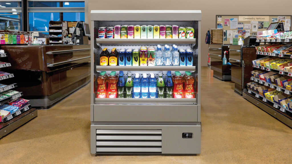 Image showing FPG Impulse Slim 12H Refrigerated food and drinks display cabinet fully stocked at supermarket checkout.
