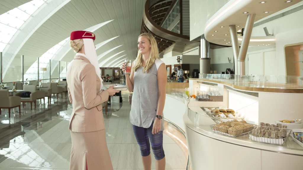 Image showing FPG Custom Cabinets with Petra Kvitova on a tour of the Emirates Lounge at Dubai International Airport.