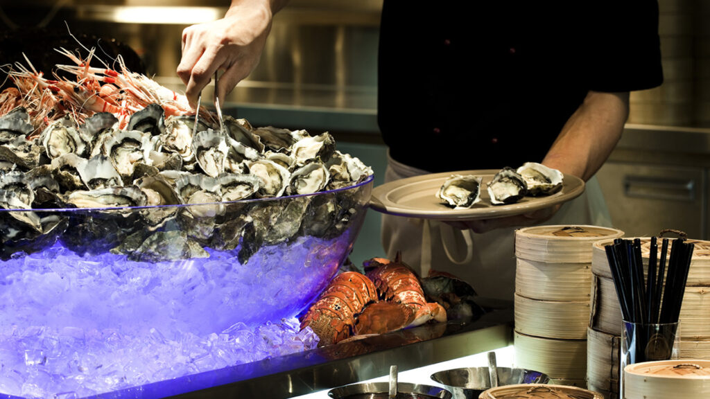 Eight Restaurant, Langham Hotel, Auckland, New Zealand. FPG Custom Fitout including refrigerated ice display for the display of shellfish. Delivered in partnership with Wildfire Commercial Kitchens & Bars.