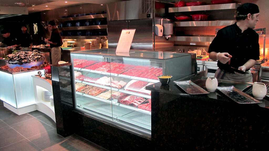 Eight Restaurant, Langham Hotel, Auckland, New Zealand. FPG Custom Fitout including refrigerated meat cabinet. Delivered in partnership with Wildfire Commercial Kitchens & Bars.