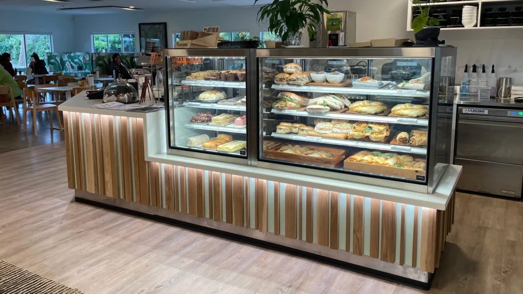Image showing No. 5 Café & Larder, Hastings, New Zealand. Custom fitout including underlit counter joinery and Inline 4000 refrigerated food display cabinets.