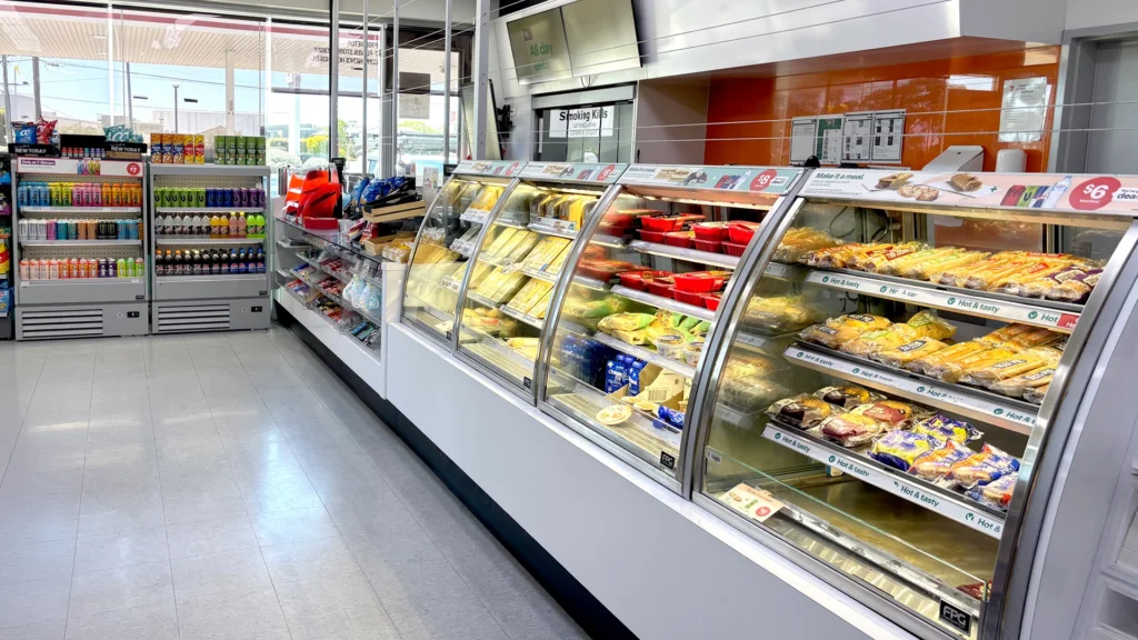 Image showing FPG Impulse Slim 13H 09W Refrigerated and FPG Inline 5000 Curved Open Front food and drinks display cabinets at 7 Eleven, Australia.
