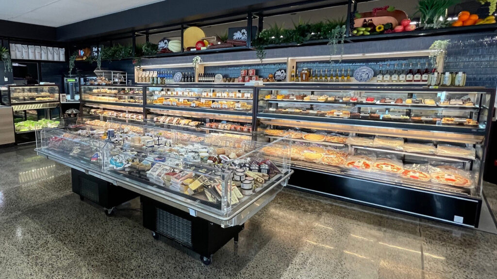 Image showing an impressive line-up of FPG Isoform Grab&Go 2400 refrigerated cabinets at IGA Caulfield, Australia.