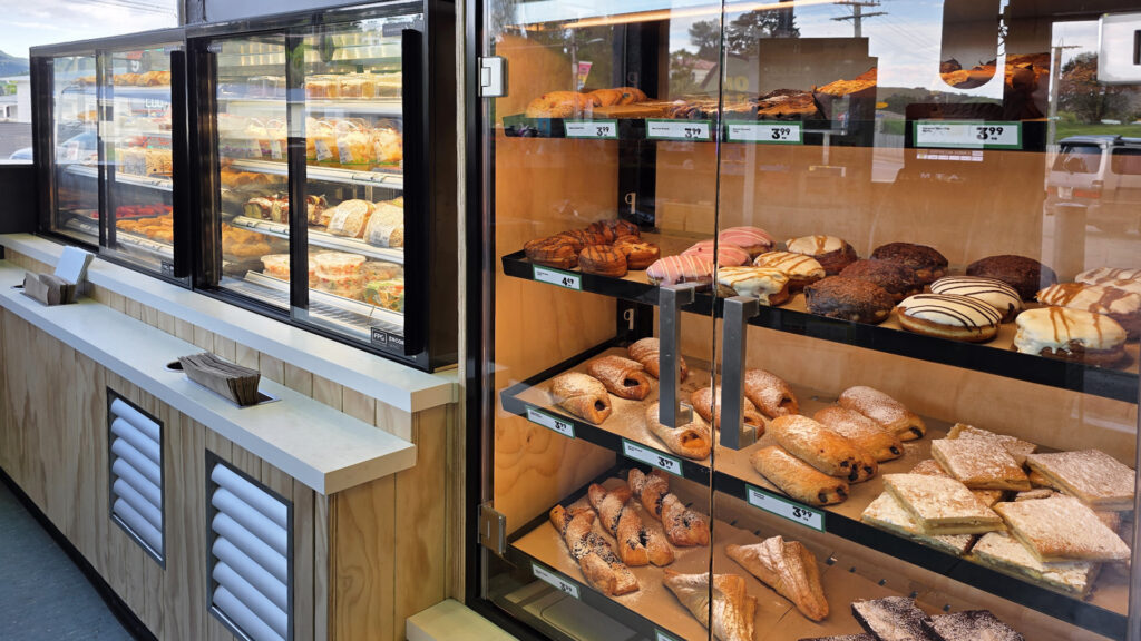A lineup of FPG Encore Series 8 cabinets with adjacent custom bakery unit at 4 Square, Tokomaru Bay, New